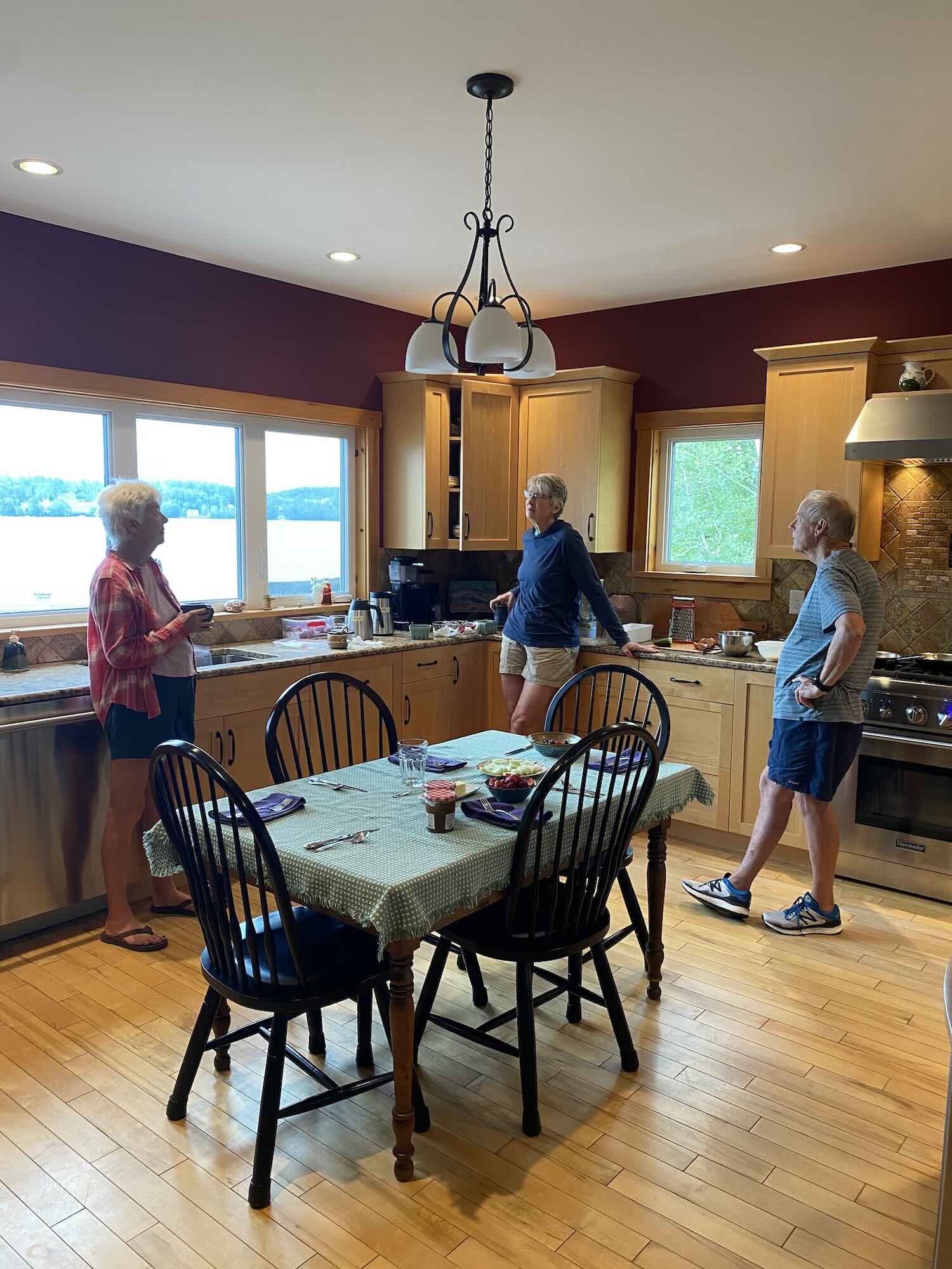 3 people in a kitchen